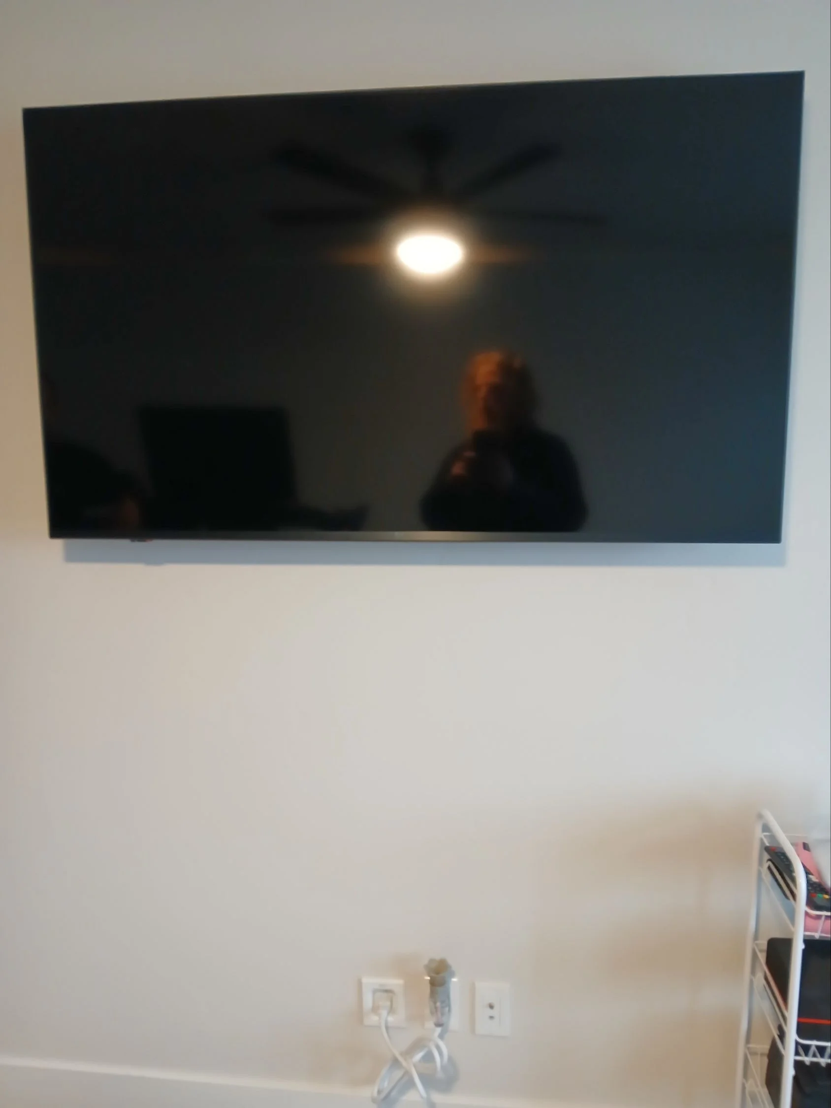 Wall-mounted television installation with a considered wire-concealment finish in Meridian